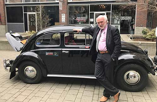 Photo of Chris Beresford with the beetle car - Race for Deirdre
