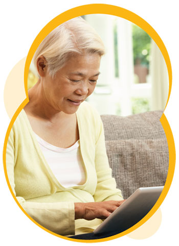 An older woman looking at a tablet