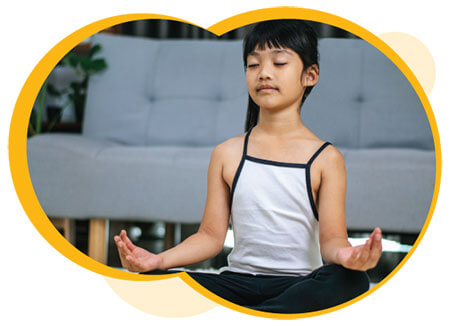 A kid sitting criss cross meditating