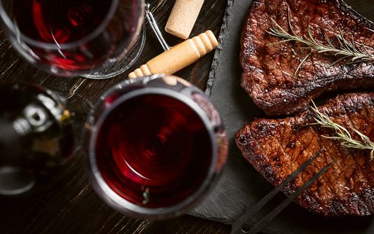 A steak and wine meal