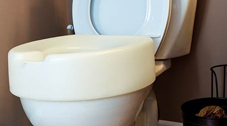 Photography of raised toilet seat