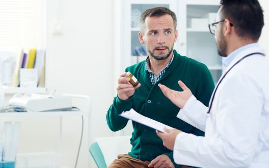 A man discussing with his doctor