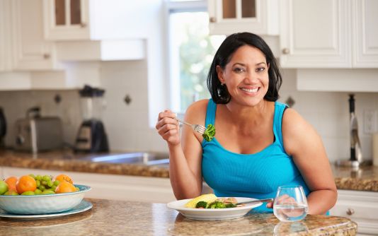 Image of woman with arthritis eating healthy food